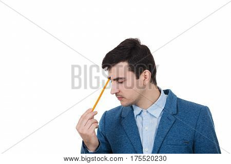Businessman with thoughtful emotion and a pencil pointed to his head planning his future have ideas. Isolated on white background.