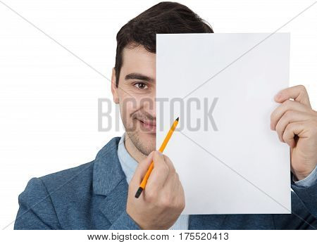 Businessman smiling holding pencil and covering half face with a empty white papper try to draw a fake mask. Isolated on white background.