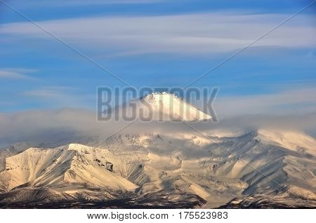 Aerial image of snow-covered Russian Volcano. Kamchatka.