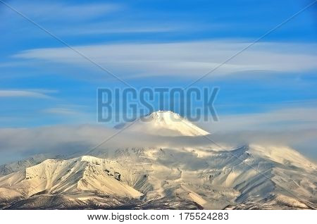 Aerial image of snow-covered Russian Volcano. Kamchatka.