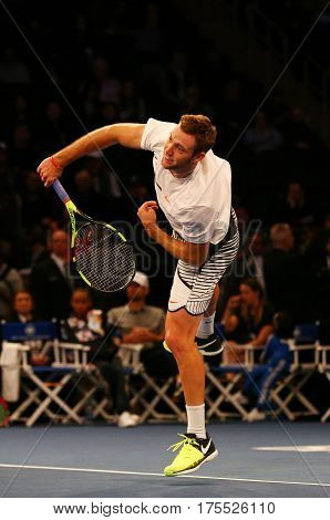 NEW YORK - MARCH 6, 2017: Professional tennis player Jack Sock of United States in action during  BNP Paribas Showdown 10th Anniversary tennis event at Madison Square Garden in New York