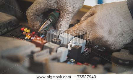 Car electric repair, electrical wiring in the car hood, close up