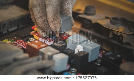 Hood of the car - electric fuses, electrical wiring, close up