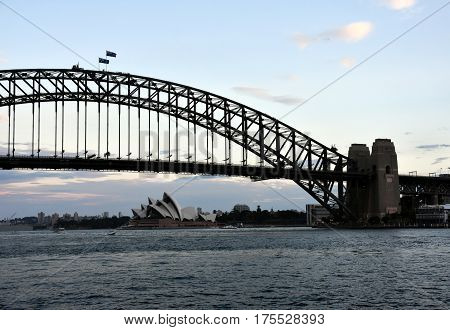 Sydney, Australia - Feb 5, 2017. Opera House and Harbour Bridge from Milsons Point Ferry Wharf at Sunset.