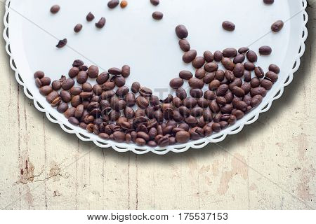 Coffee Beans On A White Plastic Plate. On Beautifull Wooden Background. Love. Insparation. On White