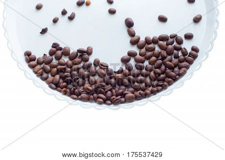 Coffee Beans On A White Plastic Plate. On Beautifull Wooden Background. Love. Insparation. On White