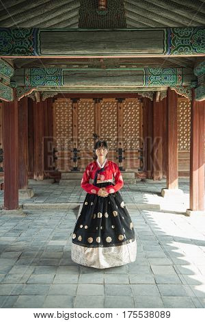 Beautiful Korean girl in Hanbok at Gyeongbokgung the traditional Korean dress.