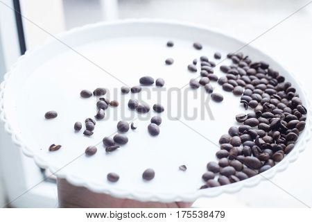 Coffee Beans On A White Plastic Plate. Beautifull Background. Love. Insparation. On White Plate.