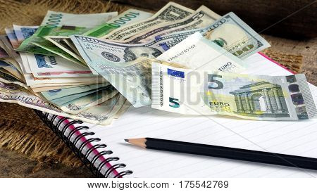 US dollars, Korean Won, Euro bills and some money bills and banknotes. Currency foreign exchange. Business and Financial or money management for investments.
