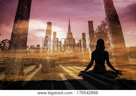 Double Exposure Of Silhouette Yoga Woman Against Sukothai Historical Park