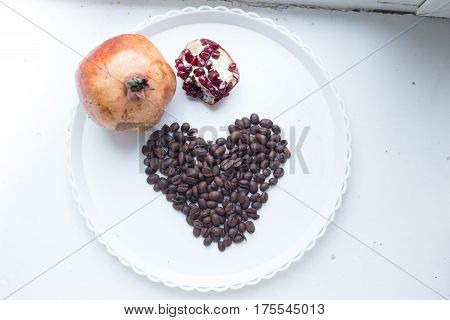Coffee Beans In Form Of Heart On Beautifull Background. Love. Insparation. On White Plate.