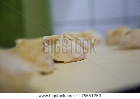 Preparation Of Manti On A Kitchen Wooden Board. Traditional Asian Dumplings