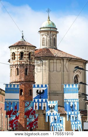 Colorful flags decorated medieval buildings before the Palio horse race, Italy