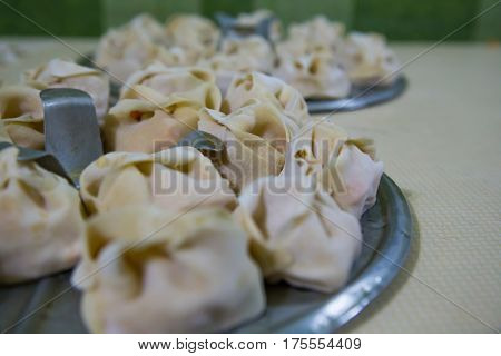 Preparation Of Manti On A Kitchen Wooden Board. Traditional Asian Dumplings