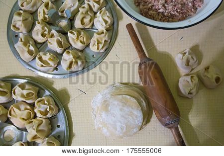 Preparation Of Manti On A Kitchen Wooden Board. Traditional Asian Dumplings