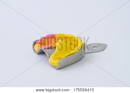 Alginate in metal bucket with white background