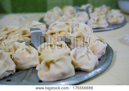Preparation Of Manti On A Kitchen Wooden Board. Traditional Asian Dumplings