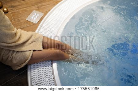 Woman enjoying jacuzzi relaxation at spa resort