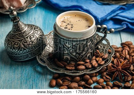 Turkish coffee and turkish delight with traditional embossed metal tray and cup