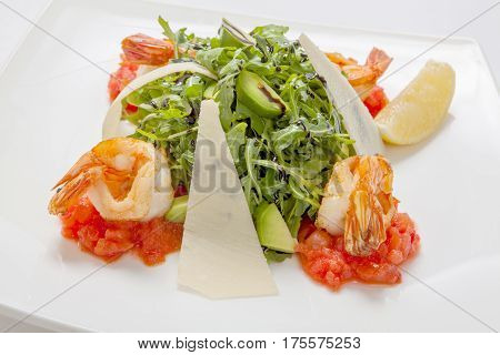 Arugula Fresh Salad With Avocado Slices With Parmesan Cheese And Fried Shrimp Flavored With Balsamic