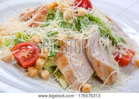 Caesar Salad With Chicken On White Plate.