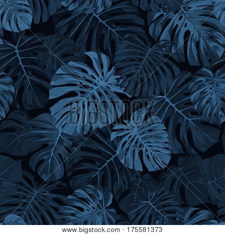 Dark blue indigo pattern with monstera palm leaves on dark background. Seamless summer tropical fabric design. Vector illustration.