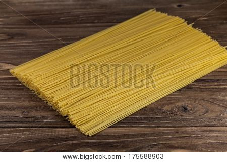 Spaghetti pasta on stone table, top view