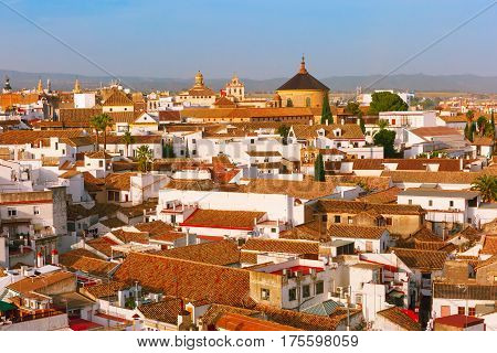 Roof of the old city and church Iglesia del Colegio de Santa Victoria, aerial view from the bell tower at the Mezquita in Cordoba, Andalusia, Spain