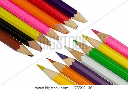 Blunt and sharp colored pencils diagonally opposite each other