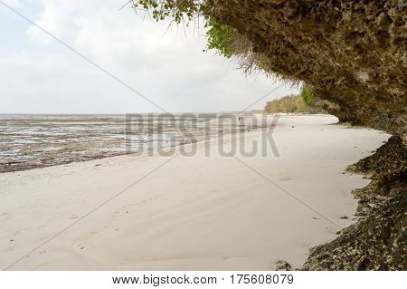Small cove with a rock on the white sand of the bamburi beach in Mombasa Kenya