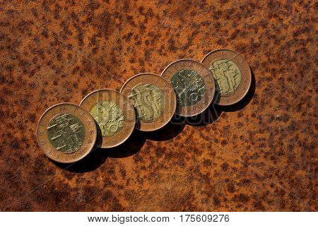 czech coins with a value of 50 crowns on rusty steel plate