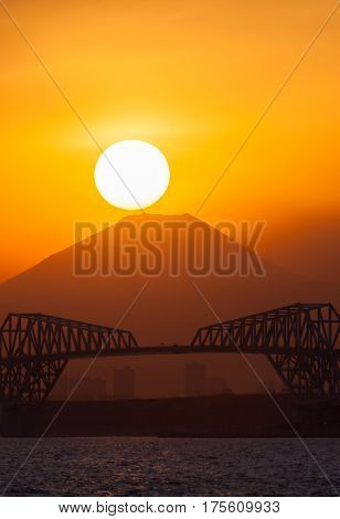 Diamond Fuji View of the setting sun meeting the summit of Mt. Fuji