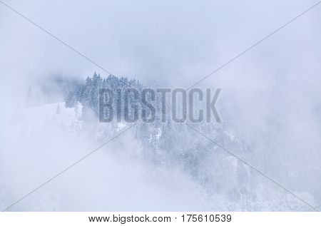 mountain top in winter fog Allgauer Alps Germany