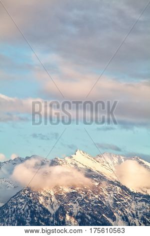 mountain peaks over sky in evening sunlight