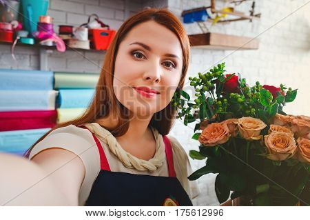 attractive young girl working in a flower shop