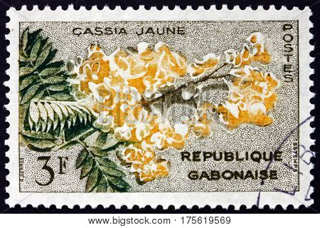 GABON - CIRCA 1961: a stamp printed in the Gabon shows Yellow cassia cassia fistula is a flowering plant circa 1961