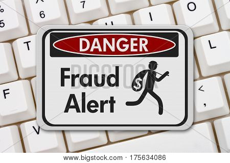 Fraud alert danger sign A black and white danger sign with text Fraud Alert and theft icon on a keyboard 3D Illustration