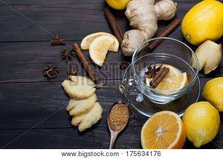 Cup Of Ginger Tea With Lemon And Honey On Dark Brown Wooden  Background