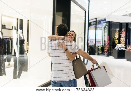Couple Glad Cuddle In Shopping Mall