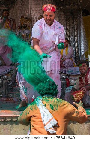 Nandgaon, India - March 17, 2016: Devotees celebrate Lathmar Holi in Nandgaon village, Uttar Pradesh, India.