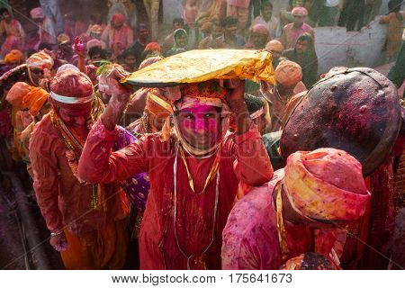 Nandgaon, India - March 18, 2016: Barsana villagers come to Nandgaon village to celebrate Lathmar Holi in Nandgaon, Uttar Pradesh, India.