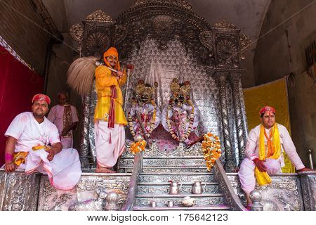Barsana, India - March 17, 2016: Devotees celebrate Lathmar Holi in Barsana village, Uttar Pradesh, India.