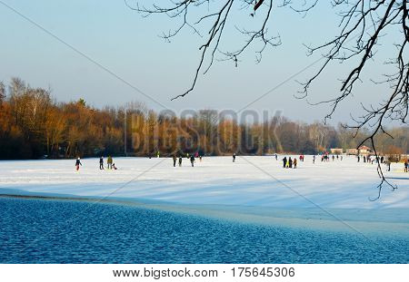The lake was frozen because cold weather