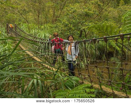 Shifen Taiwan - October 05 2016: Rope bridge over a river in the mountains near Shiften