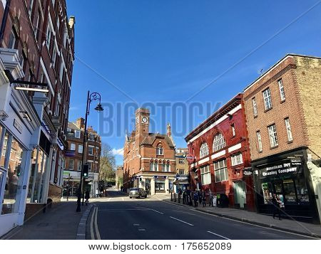 HAMPSTEAD - MARCH 9, 2017: The tube station at the crossroads on the Highstreet in Hampstead in the borough of Camden, North London, UK.