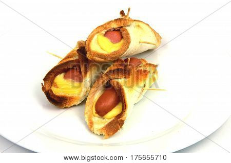 Toasted Hot Dogs and Cheese on white dish and white background
