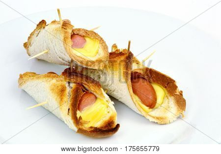 Toasted Hot Dogs and Cheese on white dish and white background