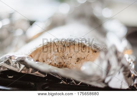 In foil baked fish salmon on roasting pan