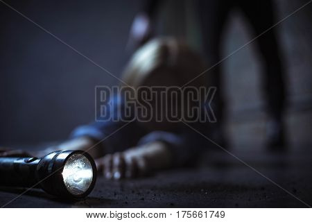 My only weapon. Desperate anxious trapped woman trying taking anything heavy enough for fighting a criminal behind her