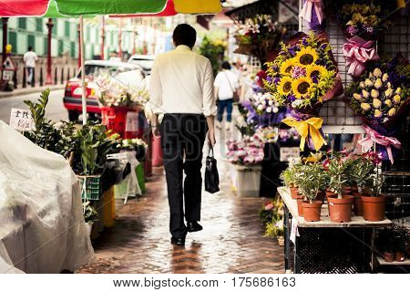 Flowers for sale on the streetside. Chinese lettering says 